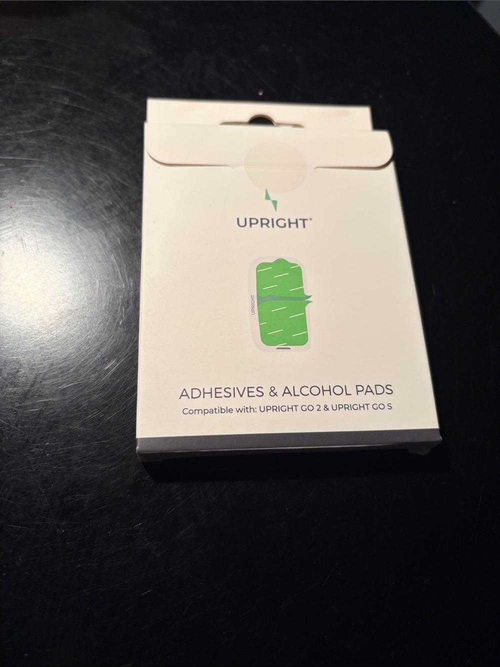 Upright GO 2 Posture Trainer adhesives to affix your trainer.